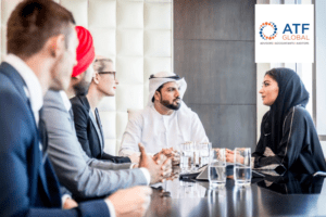 Advisors and clients in discussion around a boardroom table.